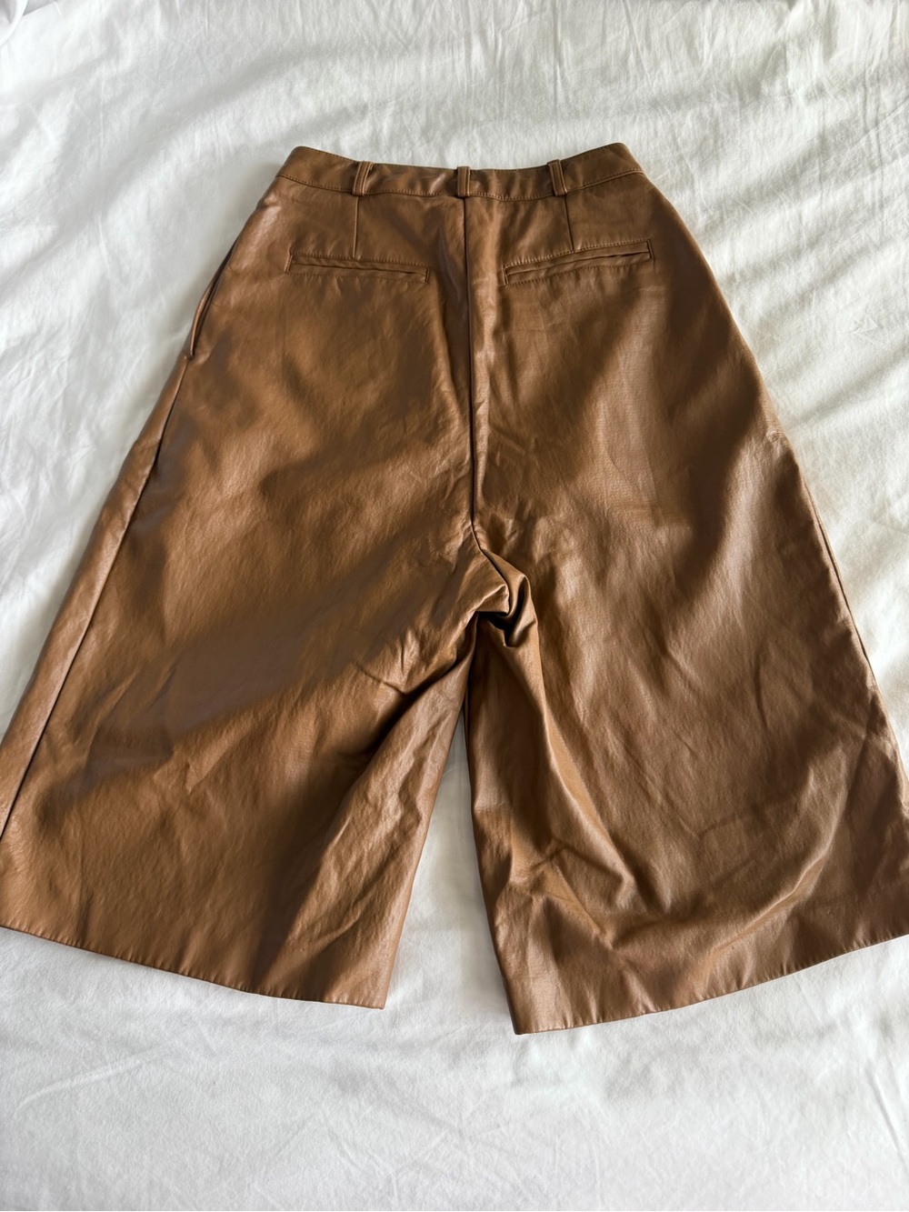 The Frankie Shop Pernille Pleated Faux Leather Shorts in Brown - Picture 11 of 16